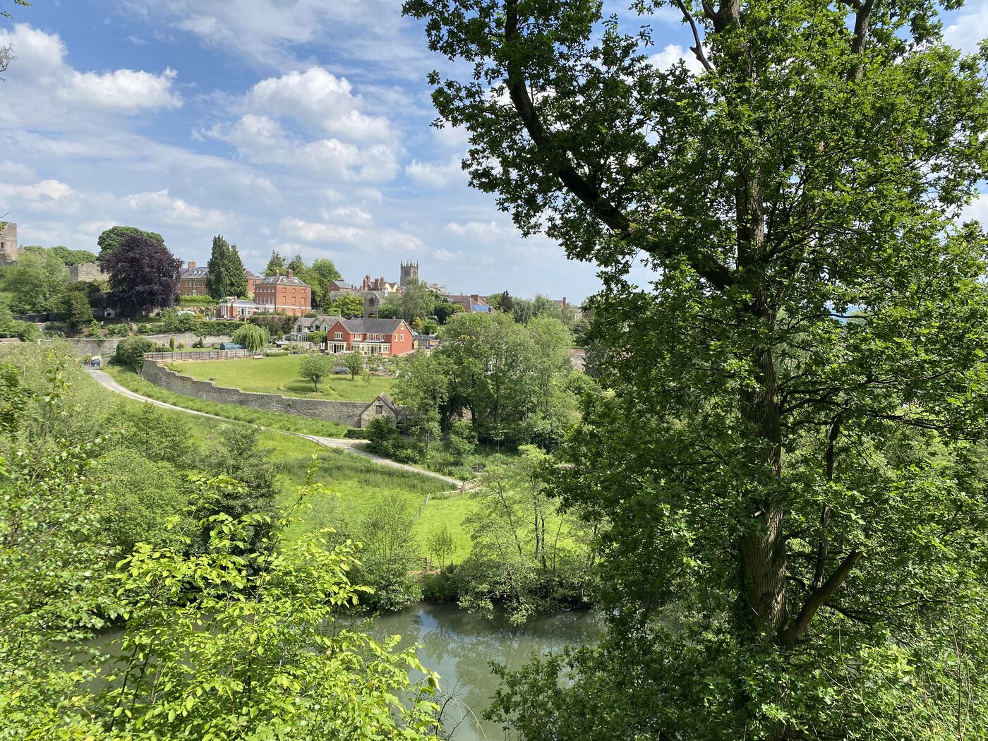 Ludlow seen across the River Teme, the castle and church rising above the town